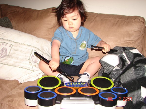 Aiden playing his drum machine. Photo